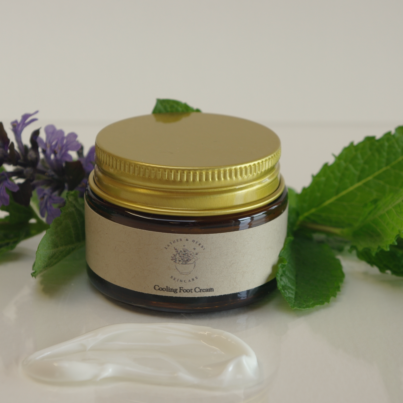 Amber glass jar with gold lid with cooling foot cream with cooling peppermint & spearmint cream