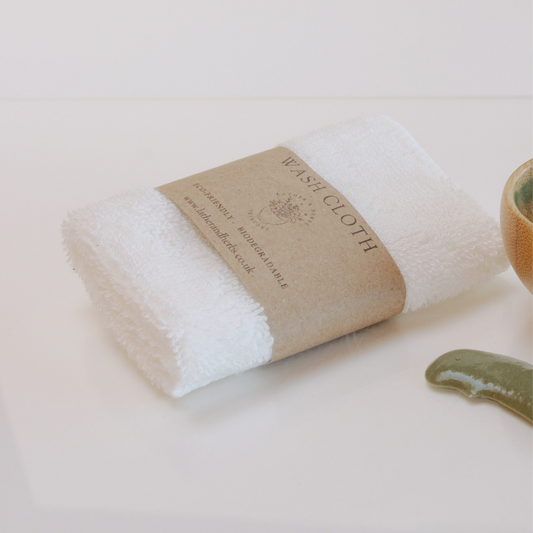 White 100% cotton wash cloth with recycled paper label