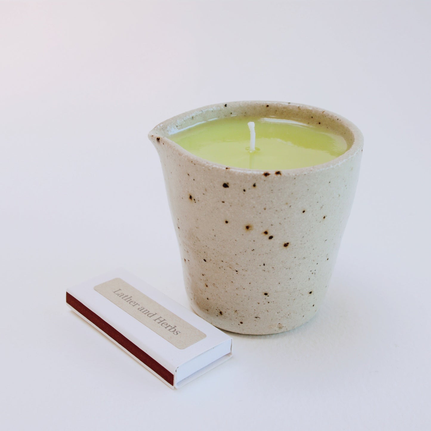 Geranium & Lavender Massage Candle in a handmade ceramic jug and box of matches