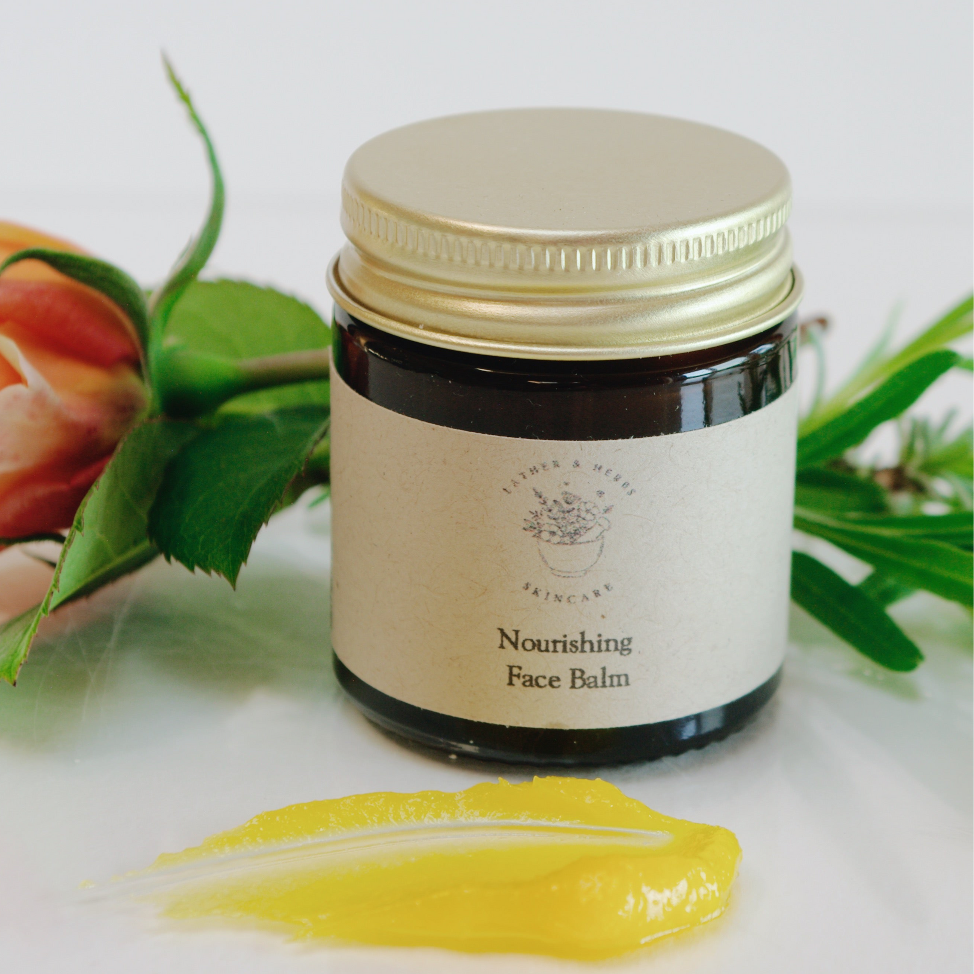 amber glass jar with balm and rose and lavender botanicals