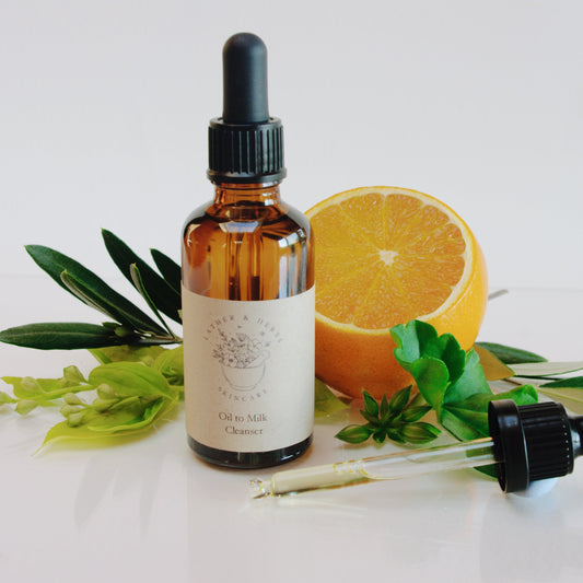 Amber glass bottle with dropper botanical sprigs and an orange