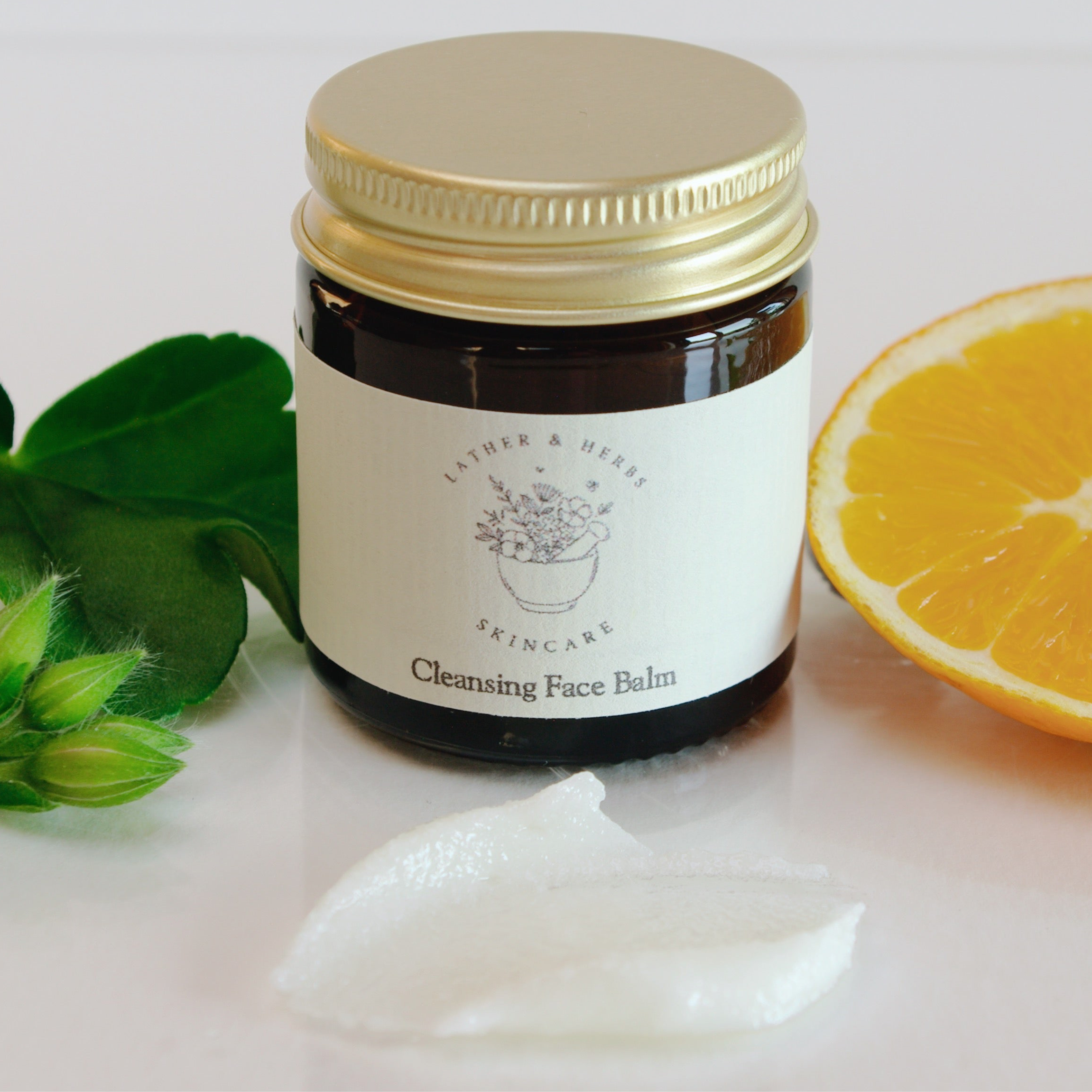 Amber glass jar with leaf orange slice and cleansing balm cream 