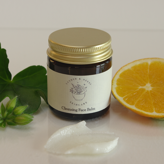 Rich cleansing balm with geranium leaf and buds, and orange slice 