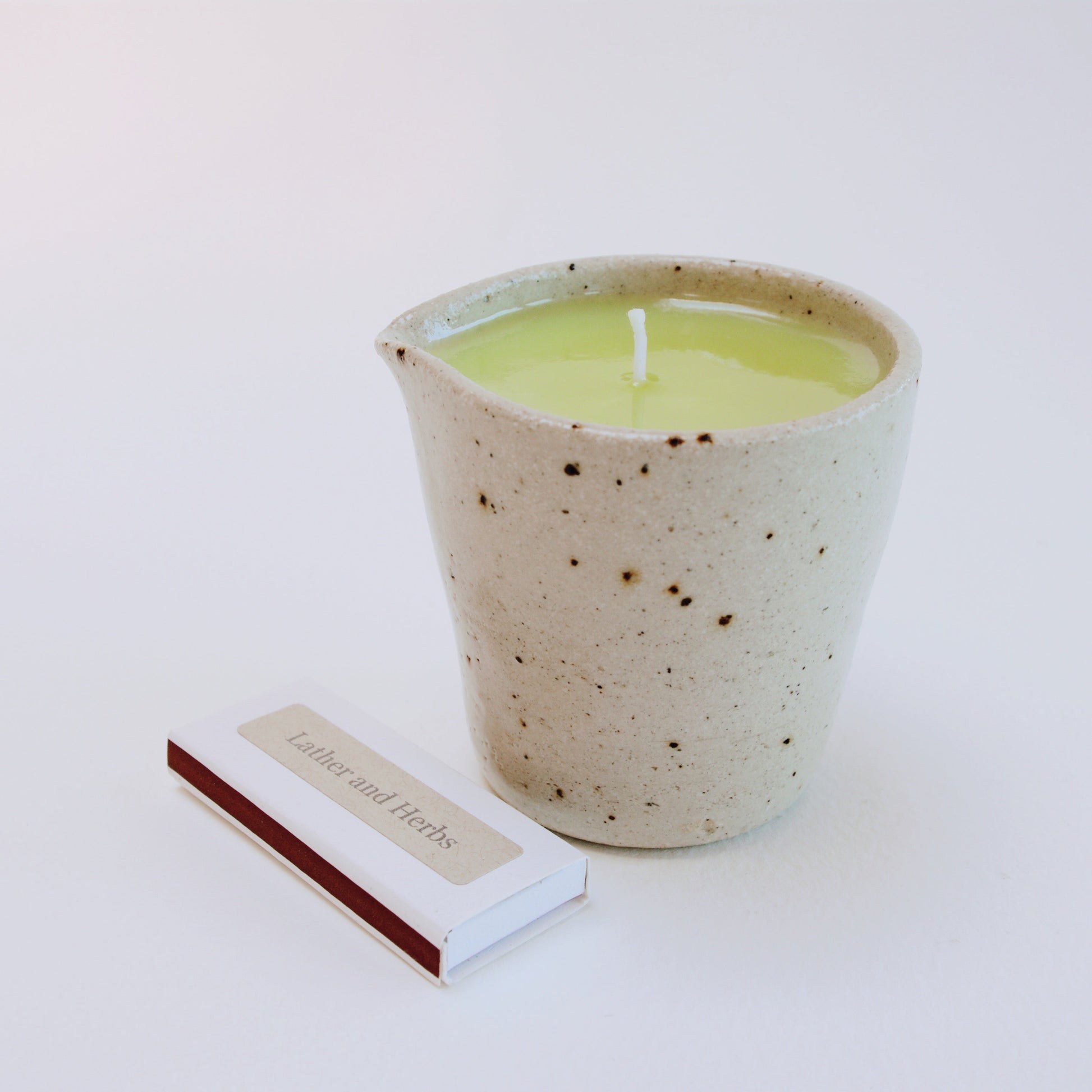 Geranium & Lavender Massage Candle in a handmade ceramic jug and box of matches