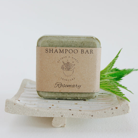 Green Nettle Rosemary shampoo bar on a handmade soap dish