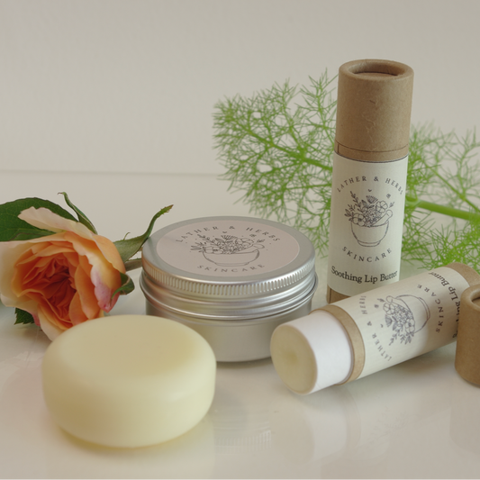 Soothing lip butter tube and aluminium pot with lid and foliage, with rose damask, frankicense and lavender essential oils