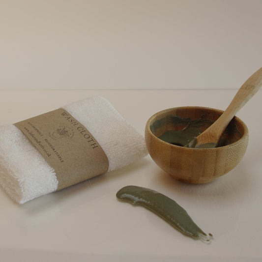bamboo mini bowl and spoon and a wash cloth
