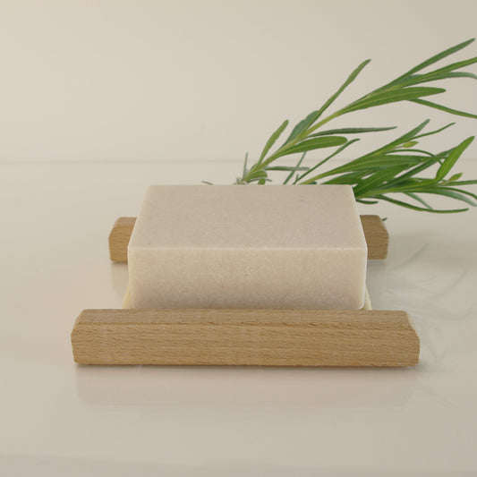 himalayan salt soap with lavender and foliage on a bamboo rack