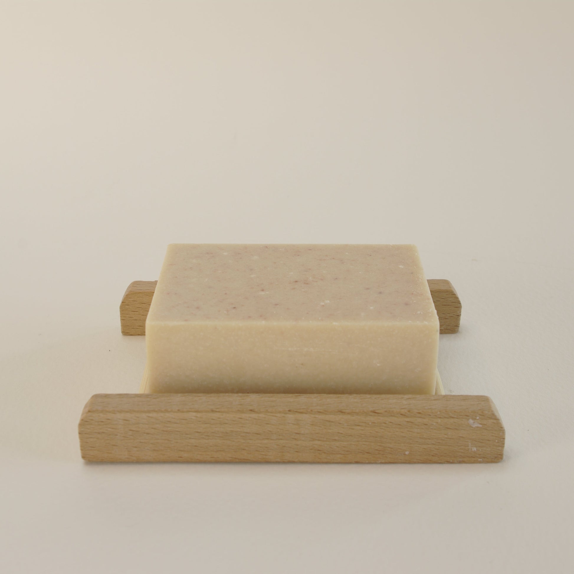 Natural salt soap bar with Himalayan and Sea Salt, Lemon & Grapefruit essential oils on a bamboo soap rack 2