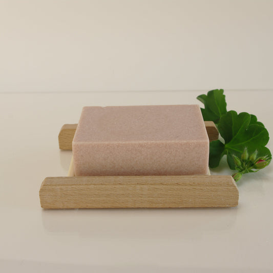 pink geranium himalayan salt soap with foliage and a bamboo soap rack