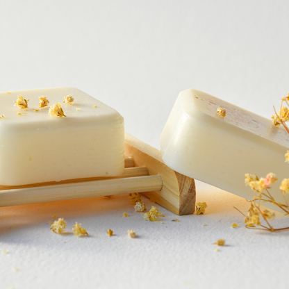 two natural rosemary conditioner bsr with flower sprig and a bamboo soap rack