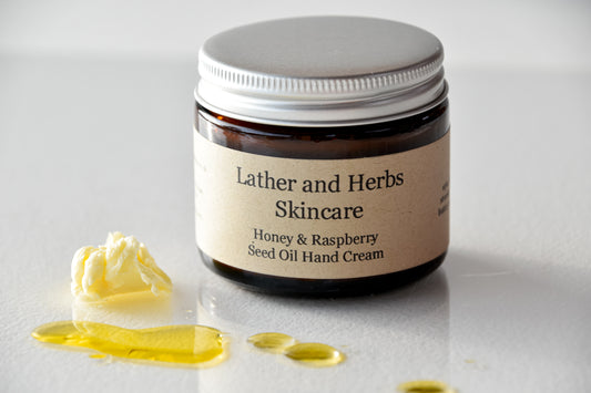 Honey, red raspberry seed oil hand cream with rapeseed oil and beeswax in an amber glassl jar with aluminium lid