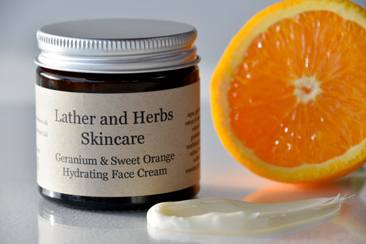 Rose Geranium and Sweet Orange hydrating face cream in amber glass jar with aluminium cap